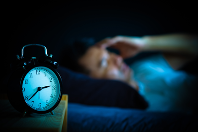 man struggling with insomnia